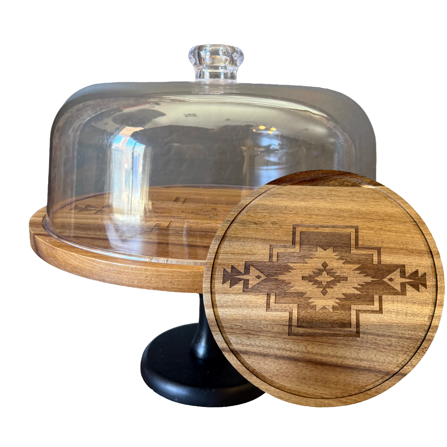 Wooden cake stand with glass dome and wooden lid featuring a geometric design on a white background