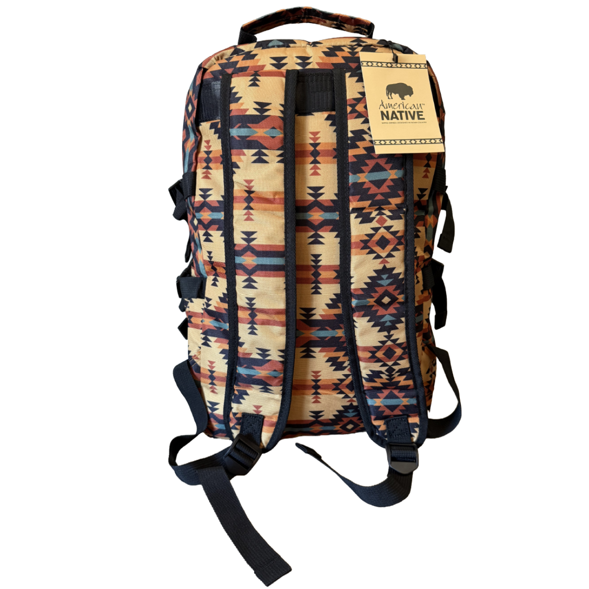 A backpack with a Southwestern geometric pattern in beige, orange, blue, and black, featuring a tan leather brand patch that reads 'SOUTH WIND NATIVE'.