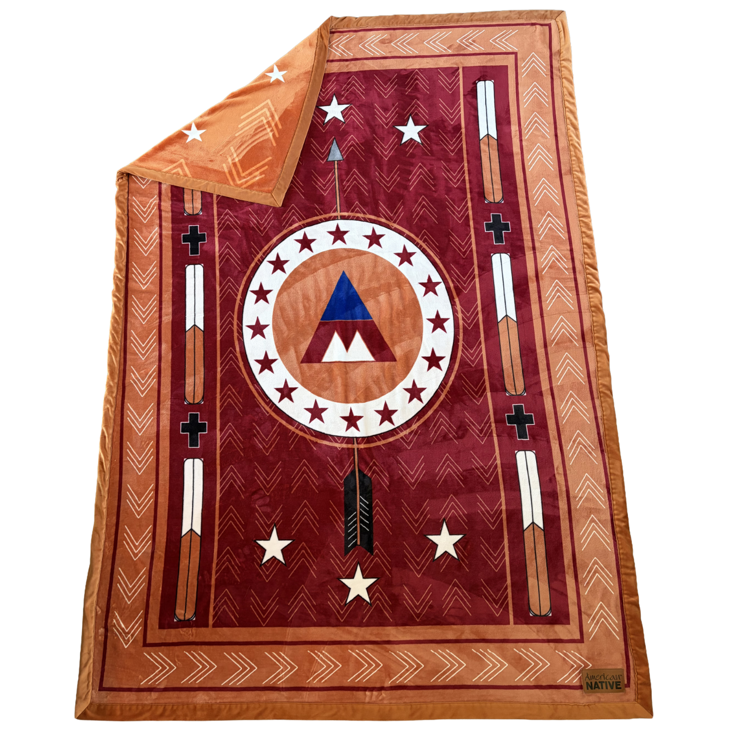 Decorative blanket with geometric patterns and symbols on a white background
