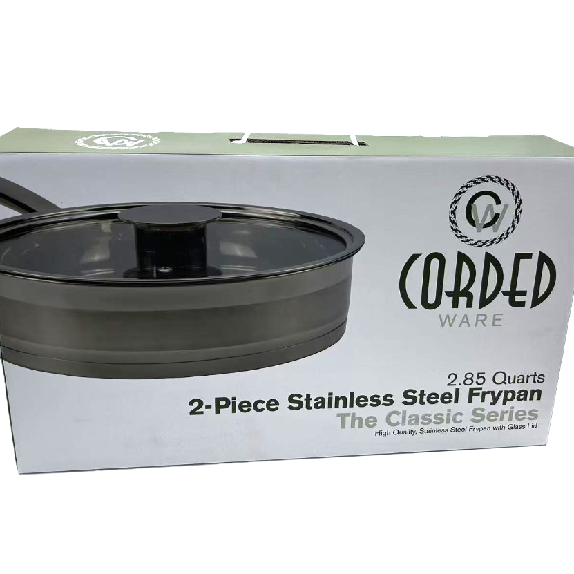Box of Cored Ware 2-piece stainless steel frypan with lid on a white background