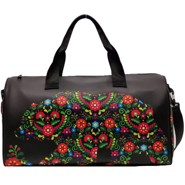 Black duffel bag with colorful floral bear design on a white background