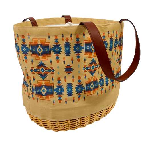 Woven basket with patterned design and brown handles on a white background