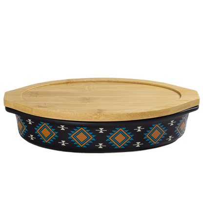 Decorative ceramic dish with a bamboo lid on a white background