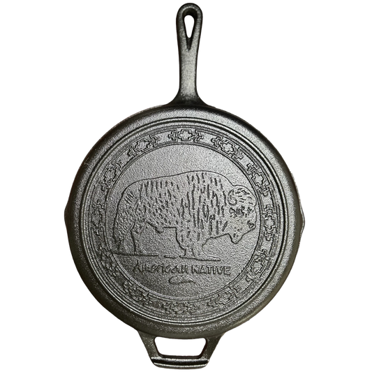Cast iron skillet with bear design and 'American Native' text inscribed