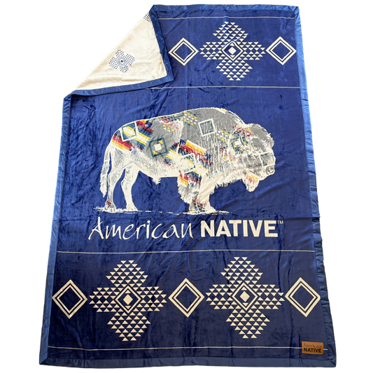 Blue blanket with a colorful bison design and 'American Native' text on a white background