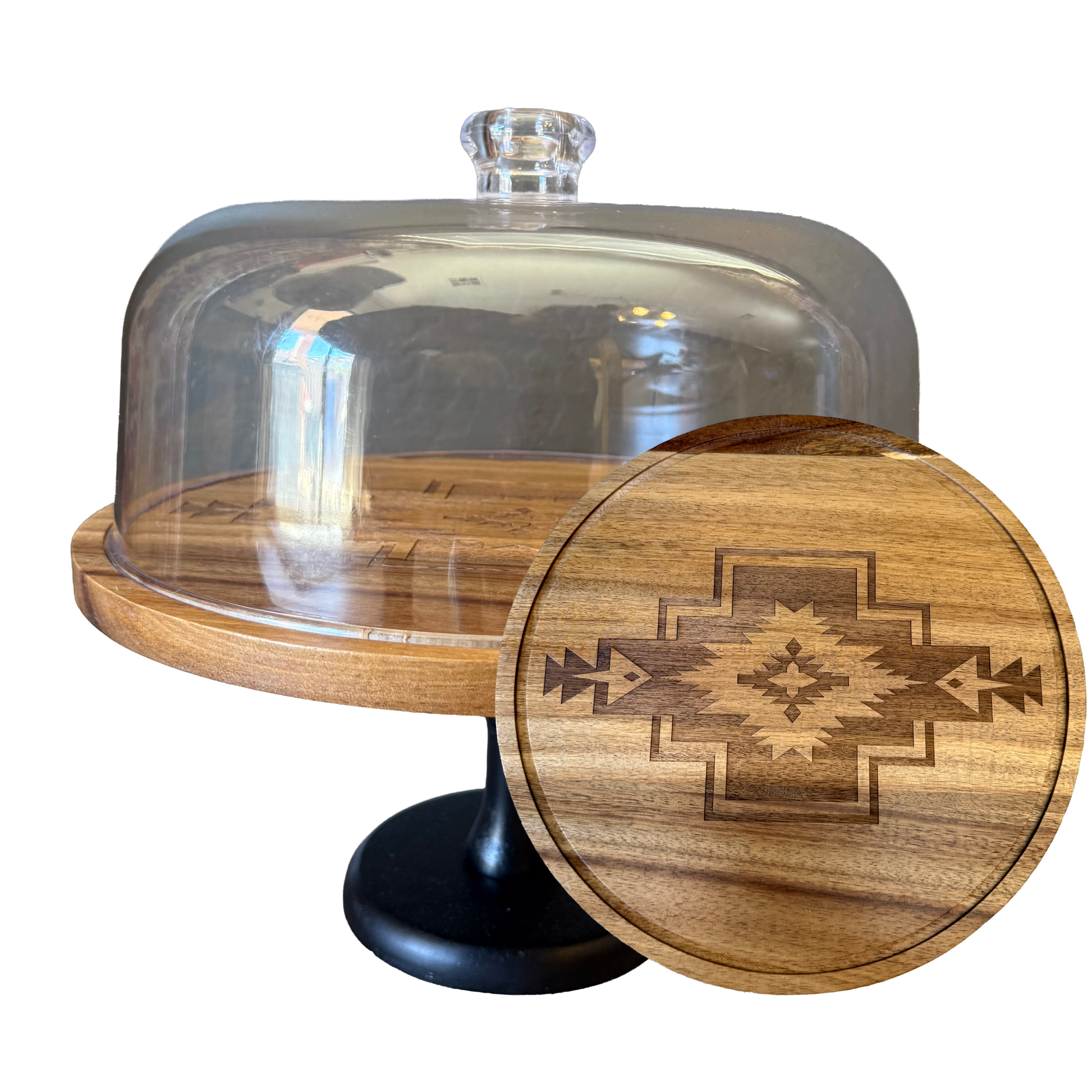 Wooden cake stand with glass dome and wooden lid featuring a geometric design on a white background
