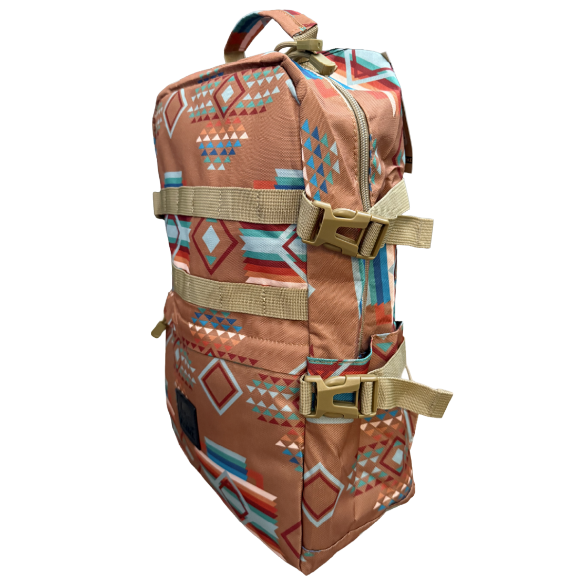 A backpack with a Southwestern geometric pattern in terracotta, blue, orange, and white, featuring tan webbing straps and plastic buckles, shown on a plain white background.