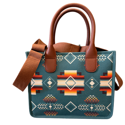 Handbag with brown leather handles and strap, featuring a geometric pattern on a transparent background