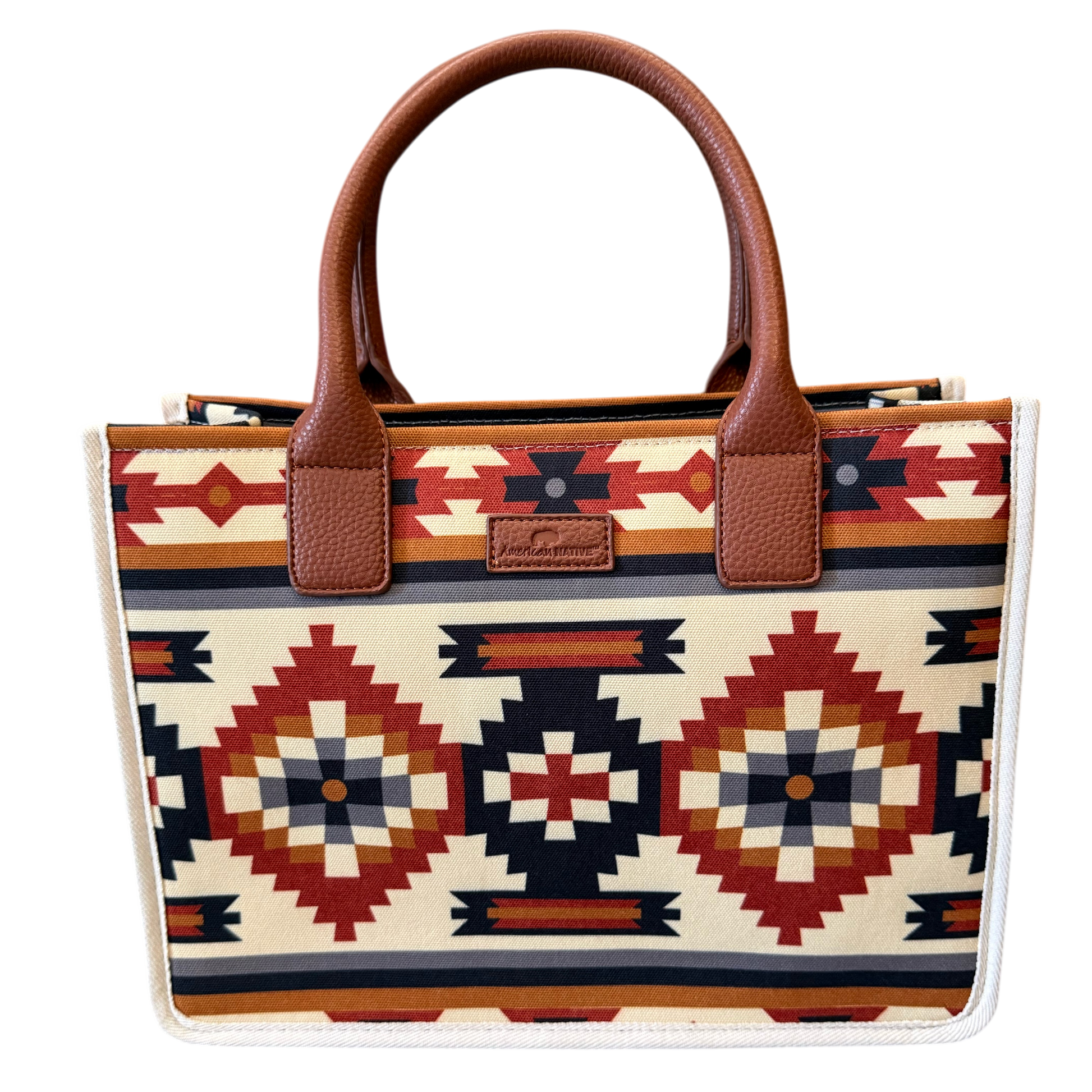 Tote bag with tribal pattern and brown handle on a white background
