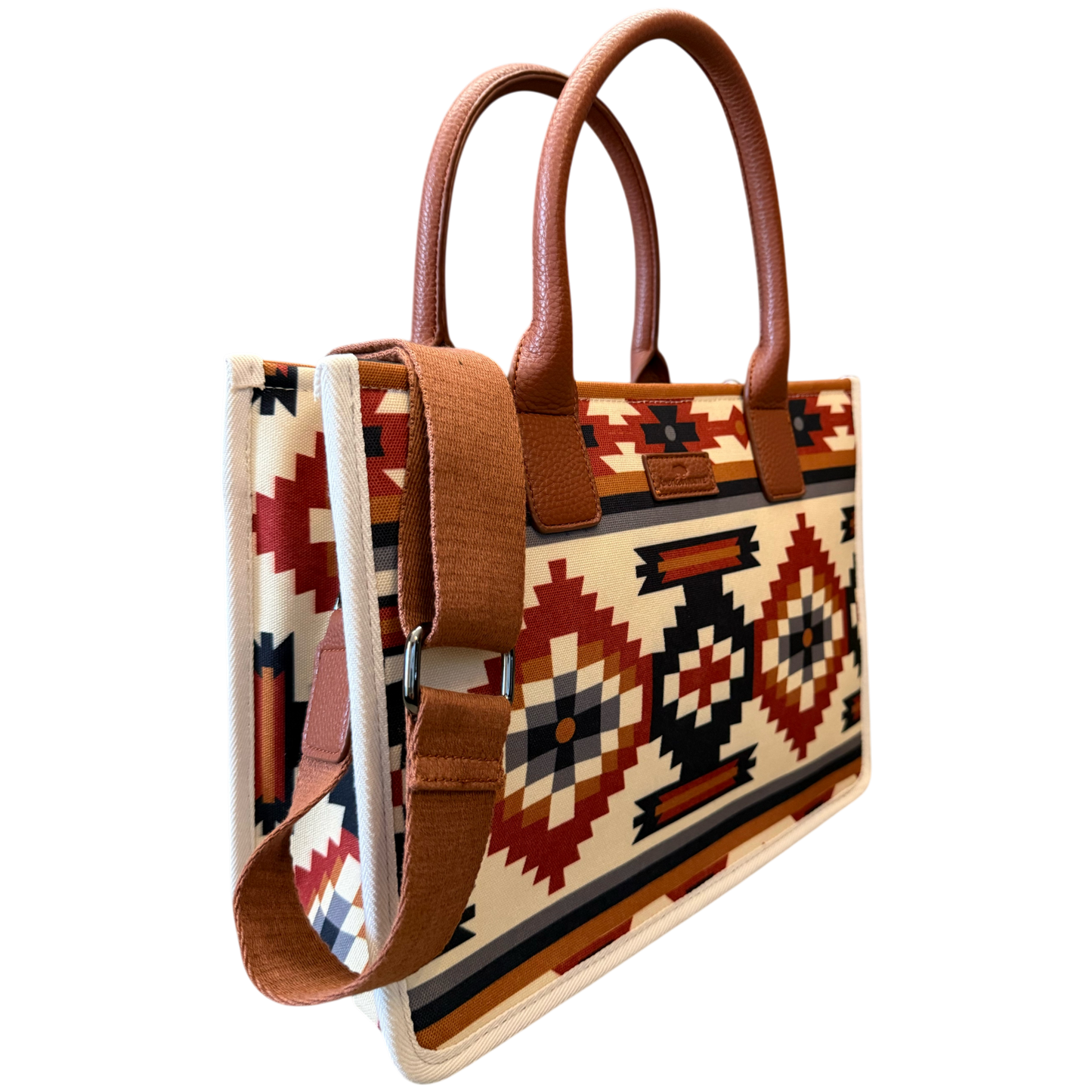 Handbag with tribal pattern and brown handles on a transparent background