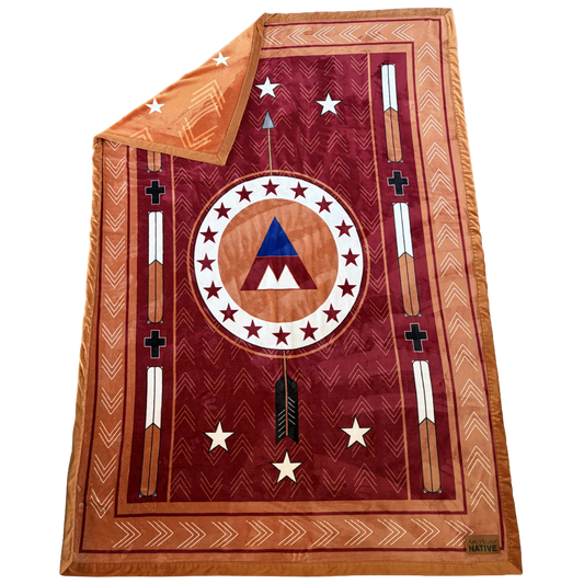 Decorative blanket with geometric patterns and symbols on a white background