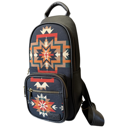 A small black shoulder bag with a Southwestern geometric pattern in red, orange, beige, and white, featuring a top handle and a detachable shoulder strap, shown on a plain white background.