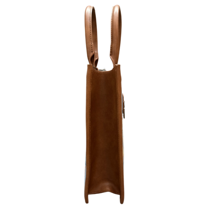 A brown leather tote bag shown from the side profile against a solid white background.