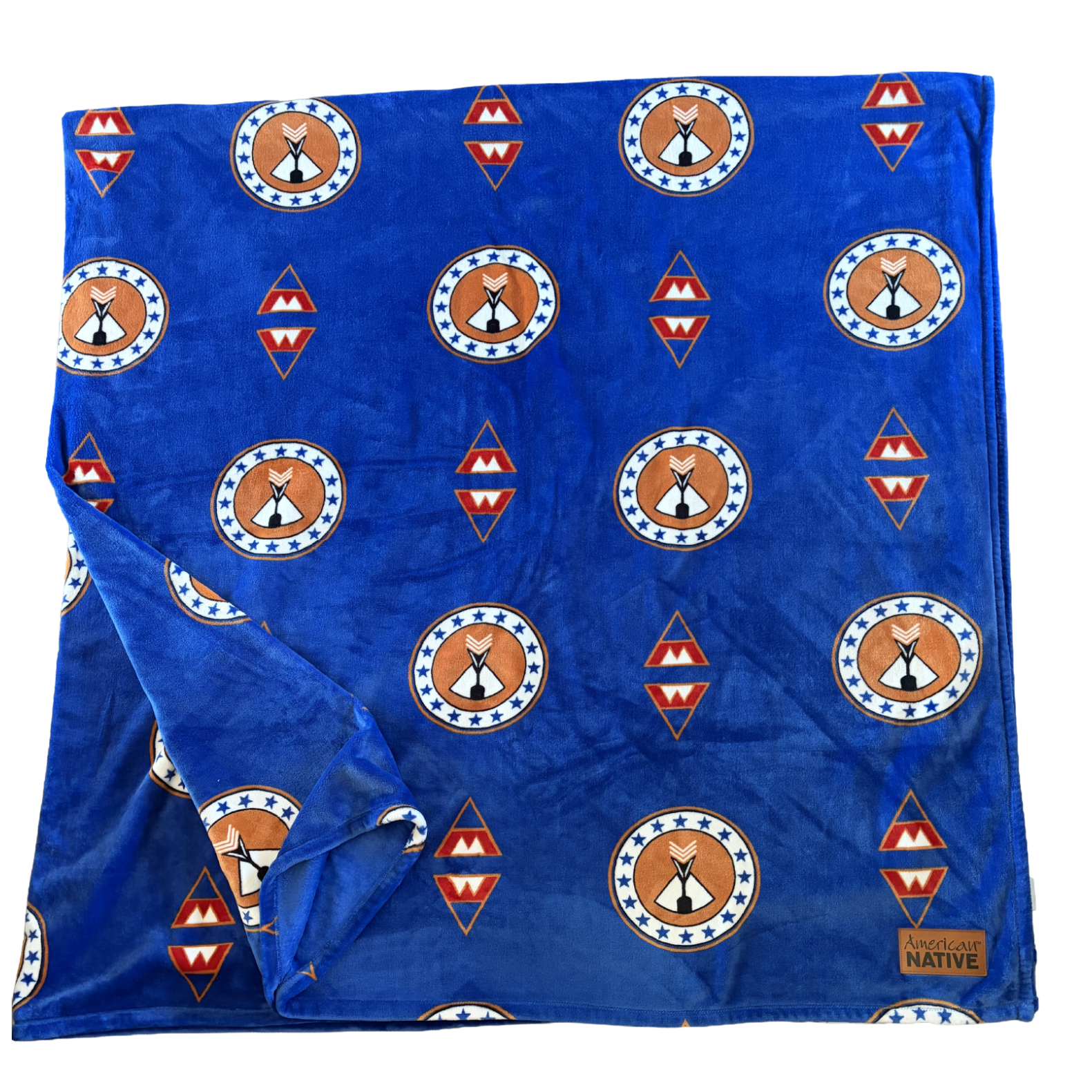 Blue fabric with Native American design patterns on a white background