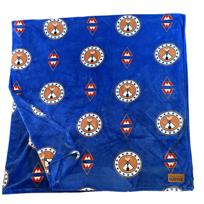 Blue fabric with Native American design patterns on a white background