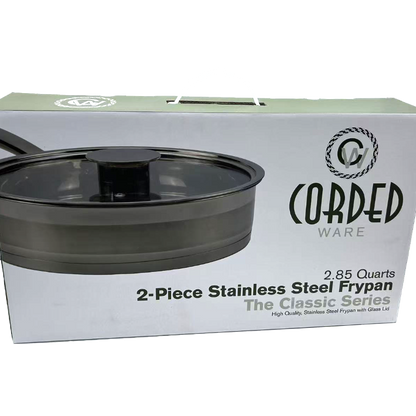 Box of Cored Ware 2-piece stainless steel frypan with lid on a white background