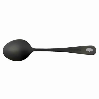A matte black metal spoon with a handle engraved with the brand name 'SPOON' and a bison logo, shown against a plain white background.