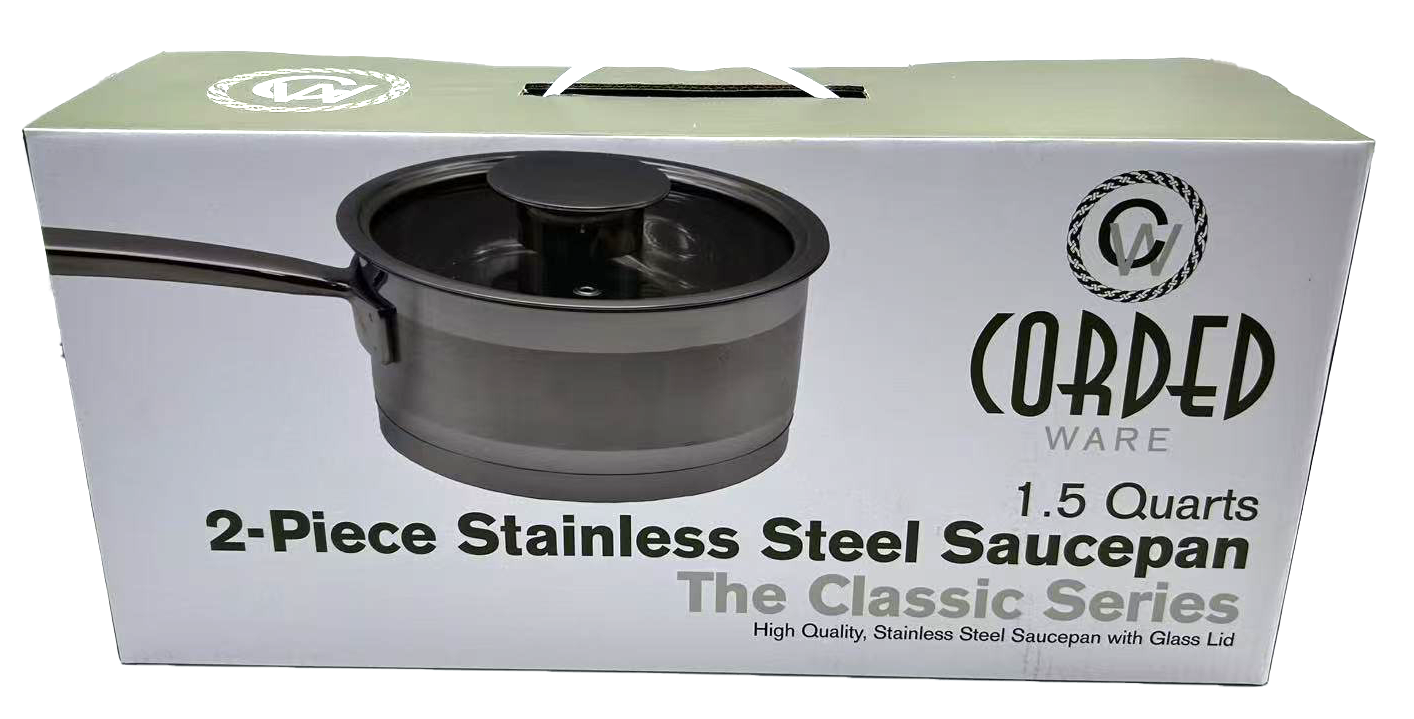 Box of Cored Ware 2-piece stainless steel saucepan with glass lid on a white background