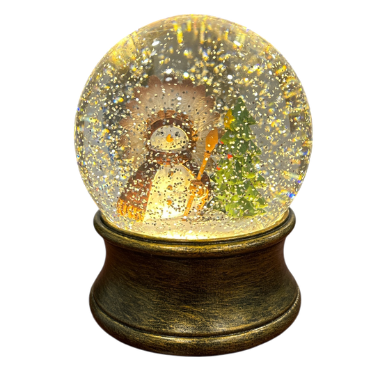 Snow globe with a native snowman inside on a white background