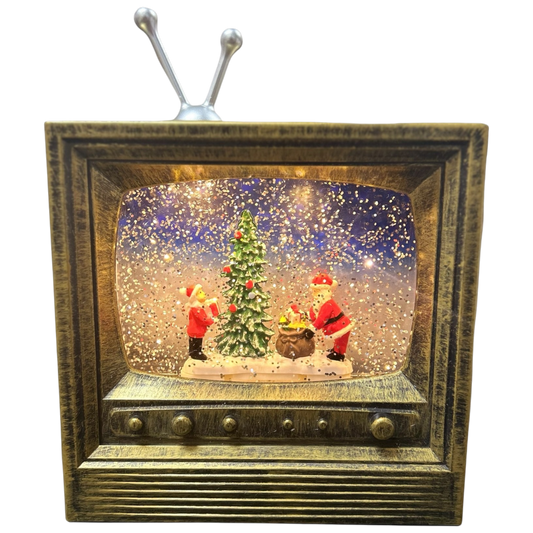 Decorative TV with a Christmas scene inside, featuring a tree and Santa Claus.