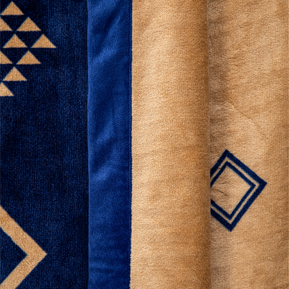Close-up of fabric with geometric patterns in blue and beige.