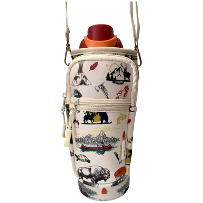 A water bottle in a soft insulated bottle bag with a cream background and a multicolor outdoor-themed print including mountains, bison, a bear, and a canoe. The bag has a top zipper, a front zip pocket, and a shoulder strap, shown against a plain white background.