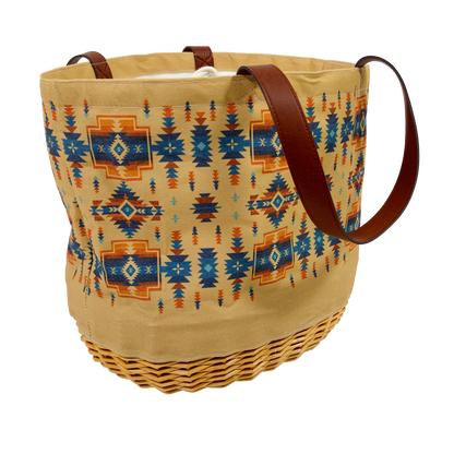 Woven basket with patterned design and brown handles on a white background